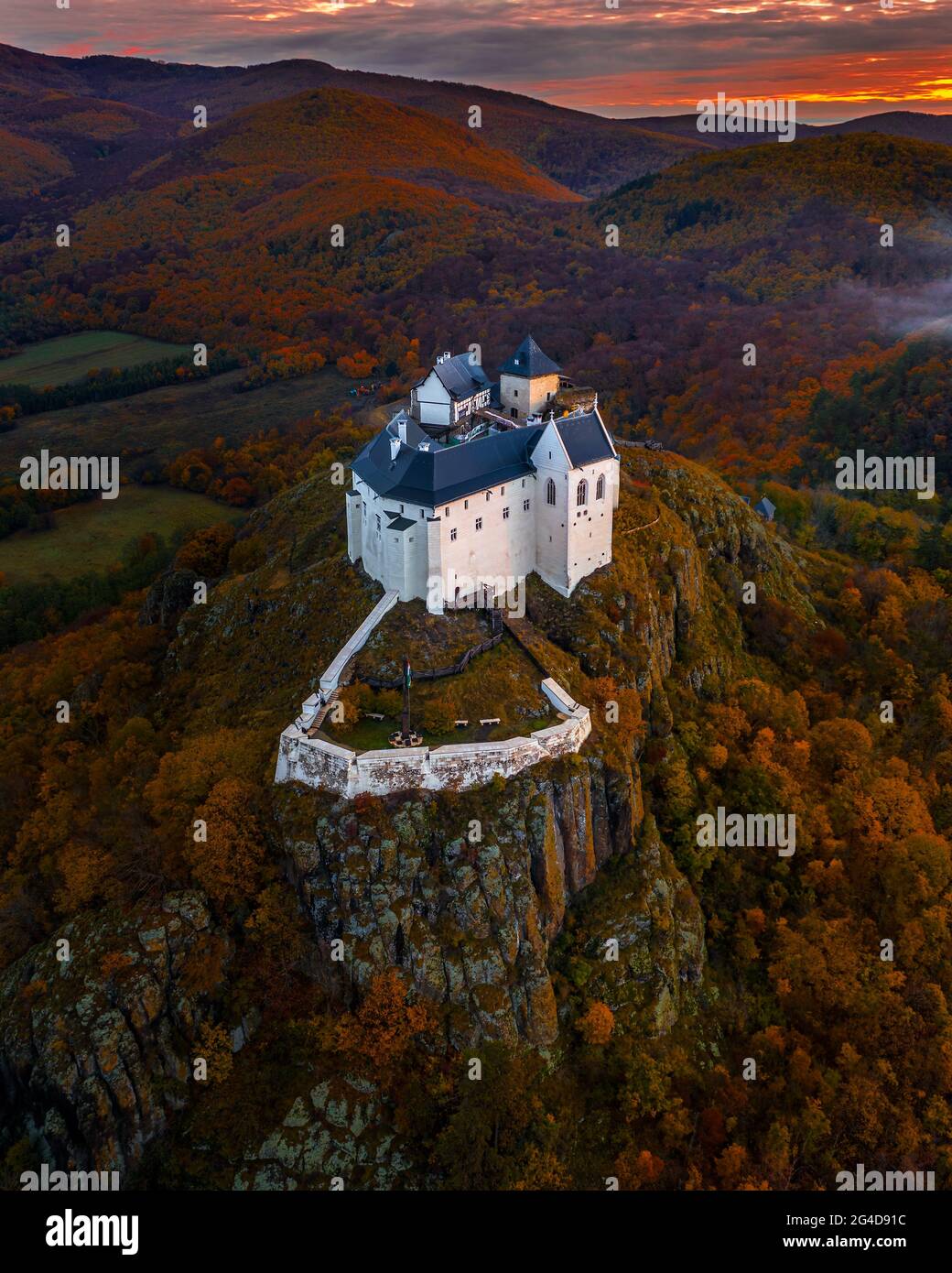 Fuzer, Hungary - Aerial view of the beautiful Castle of Fuzer with amazing colorful sunrise sky and clouds on an autumn morning. The castle has been l Stock Photo
