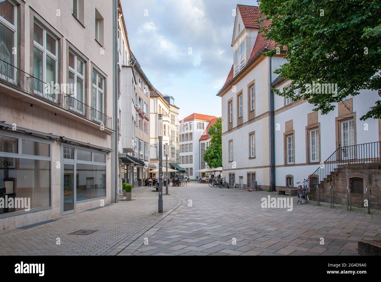 BIELEFELD, GERMANY. JUNE 12, 2021. Beautiful view of small german town with typical architecture. Restaurants on the street. Stock Photo