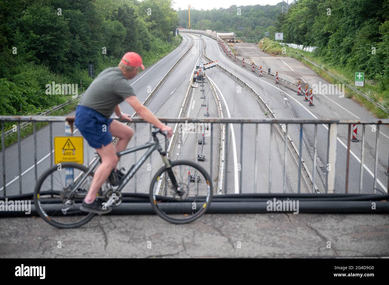 wiesbaden germany 21st june 2021 a man looks at the closed a66 after the salzbachtal bridge was closed the motorway bridge was fully closed on friday evening after large cracks were discovered