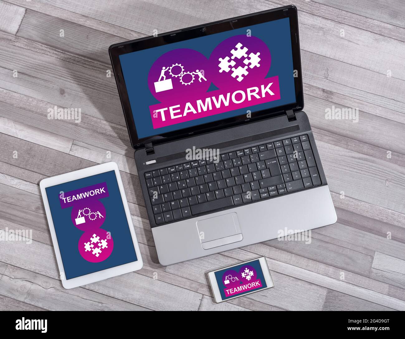 Teamwork concept shown on different information technology devices Stock Photo