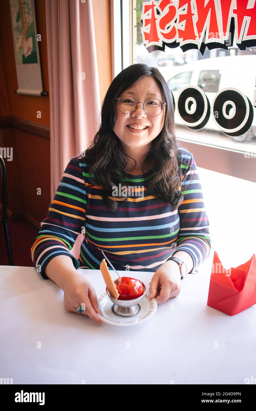 Sydney, New Bo Wa Restaurant in Moree in northern New South Wales. 21st Oct, 2020. Jennifer Wong, hostess of 'Chopsticks or Fork?', is about to sample deep fried ice cream at the New Bo Wa Restaurant in Moree in northern New South Wales, Australia on Oct. 21, 2020. TO GO WITH 'Feature: Chinese-Australian entertainer's TV program lovingly looks at life's sweet, sour moments' Credit: Lin Jie Kong/Hand out via Xinhua/Alamy Live News Stock Photo