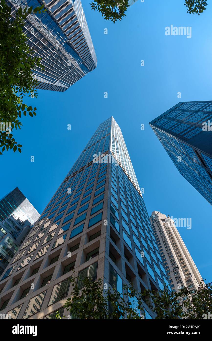 Directly below view of skyscrapers in Manhattan, New York, low angle view against sky Stock Photo