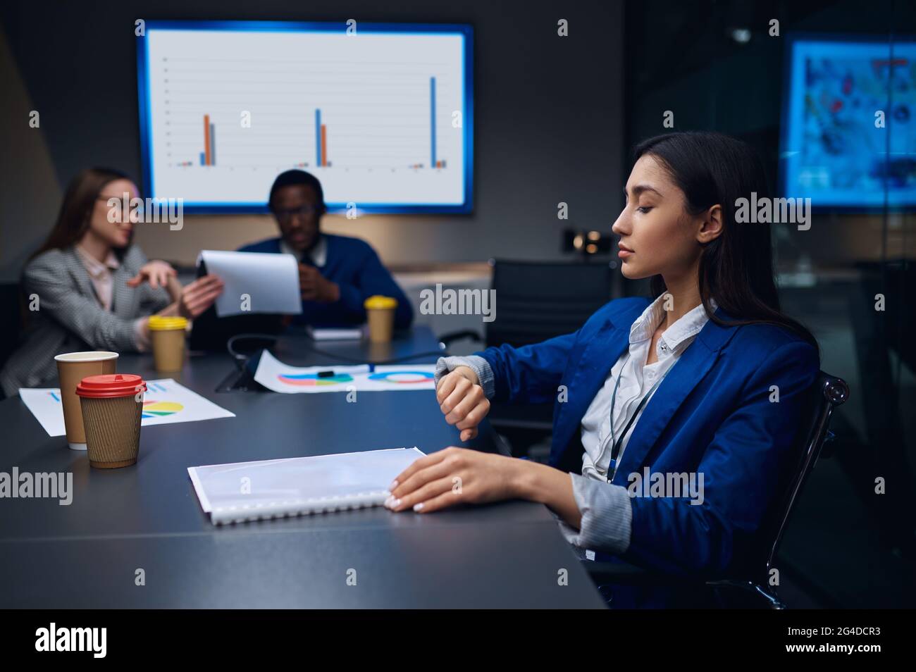 Coworkers on business negotiations in night office Stock Photo