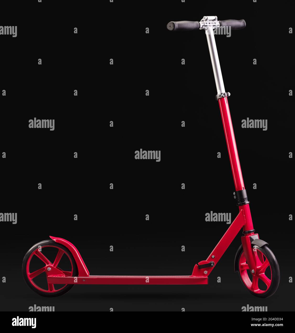 Red modern scooter studio isolated on black background with clipping path Stock Photo