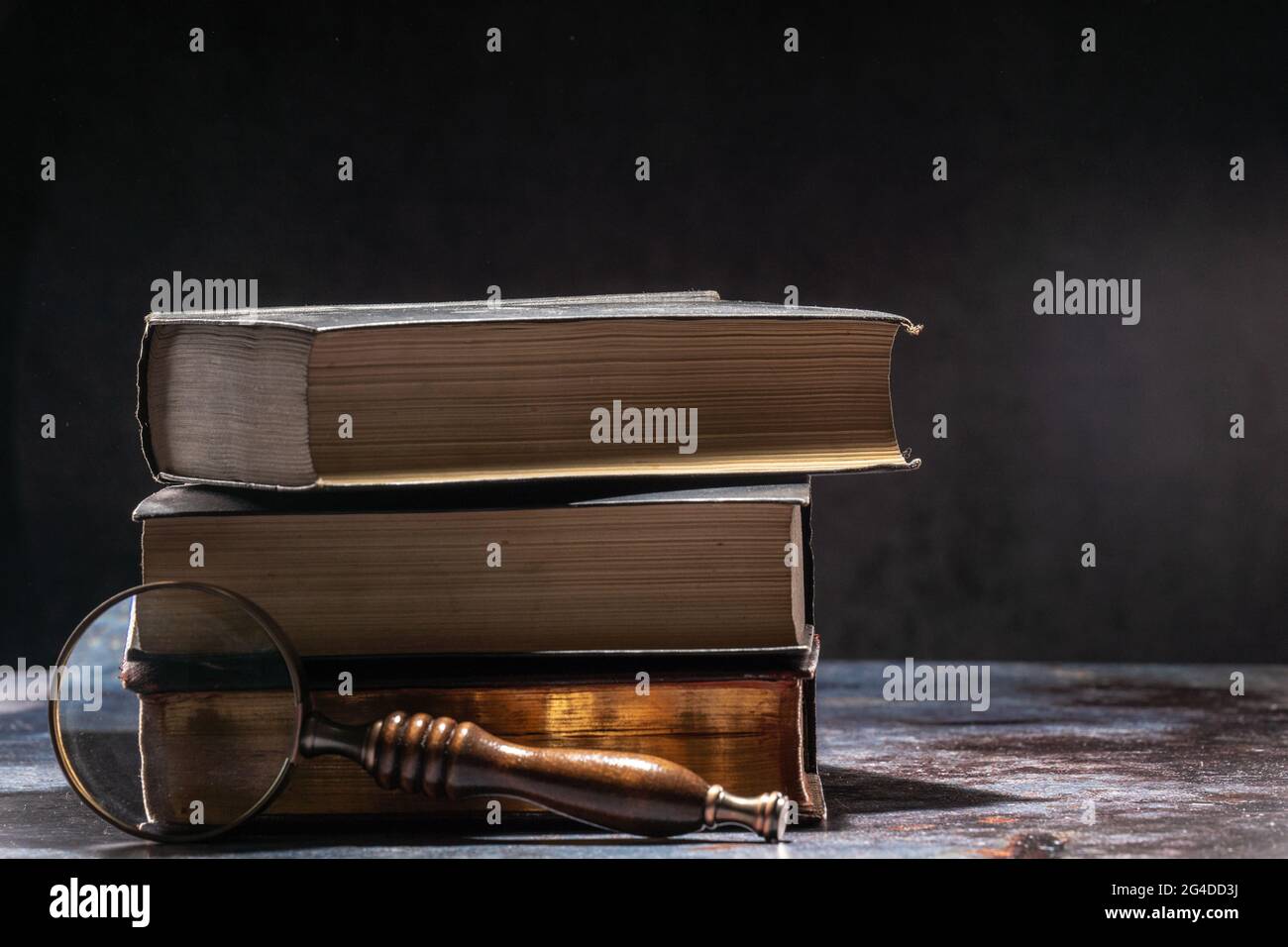 Magnifying glass lying on lot hi-res stock photography and images - Alamy