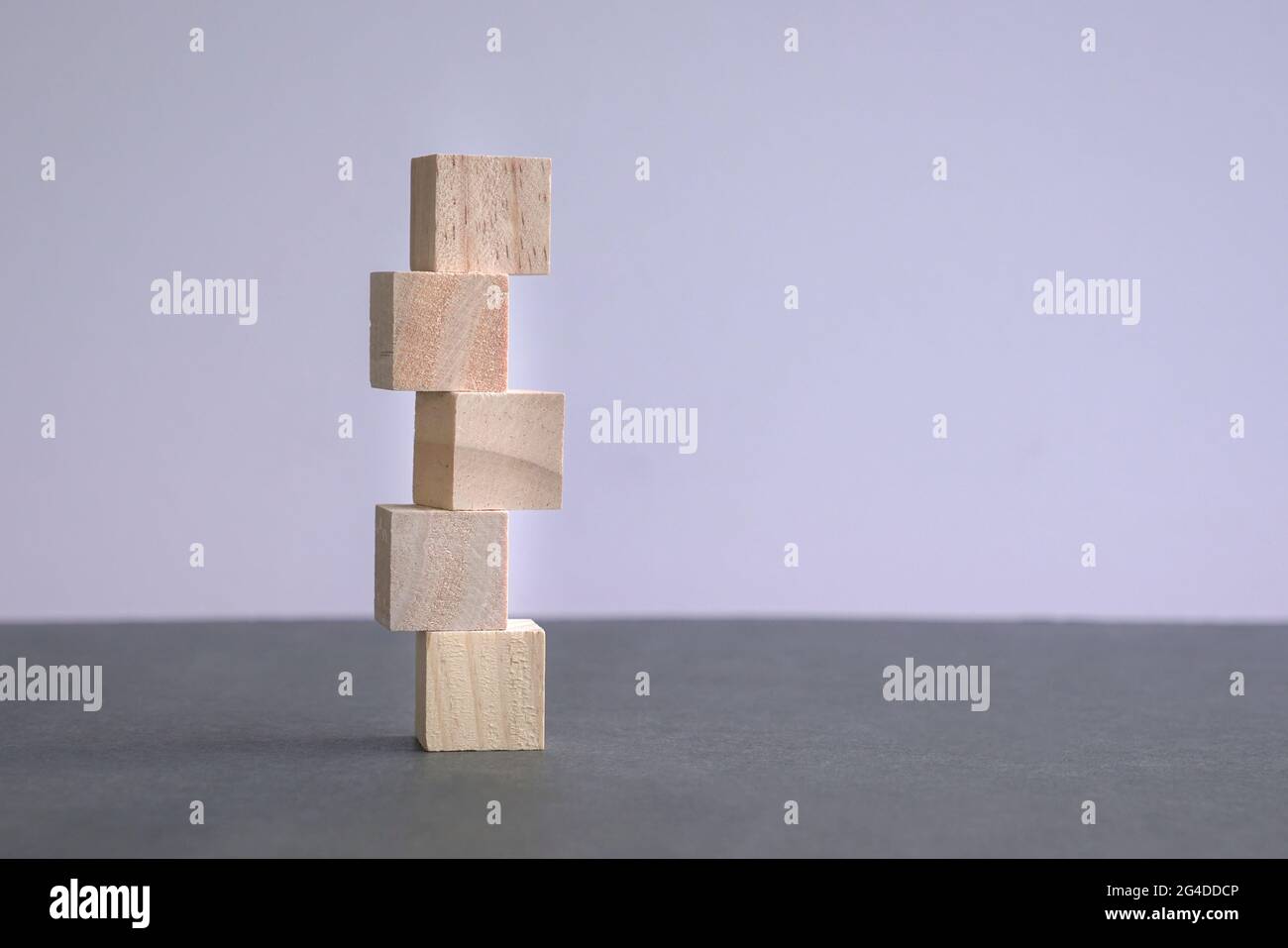 5 letter blank and wood block stacked up. Copy space Stock Photo - Alamy