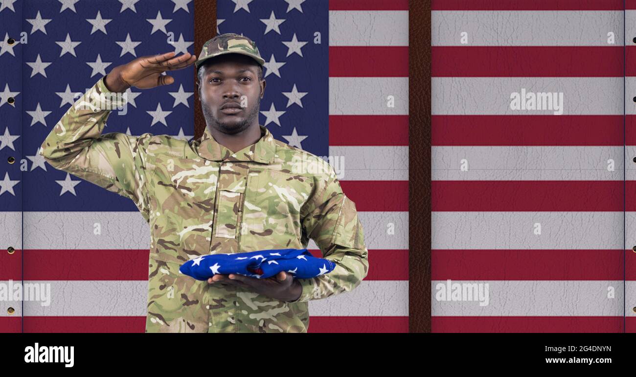 Composition of male soldier saluting over american flag Stock Photo - Alamy