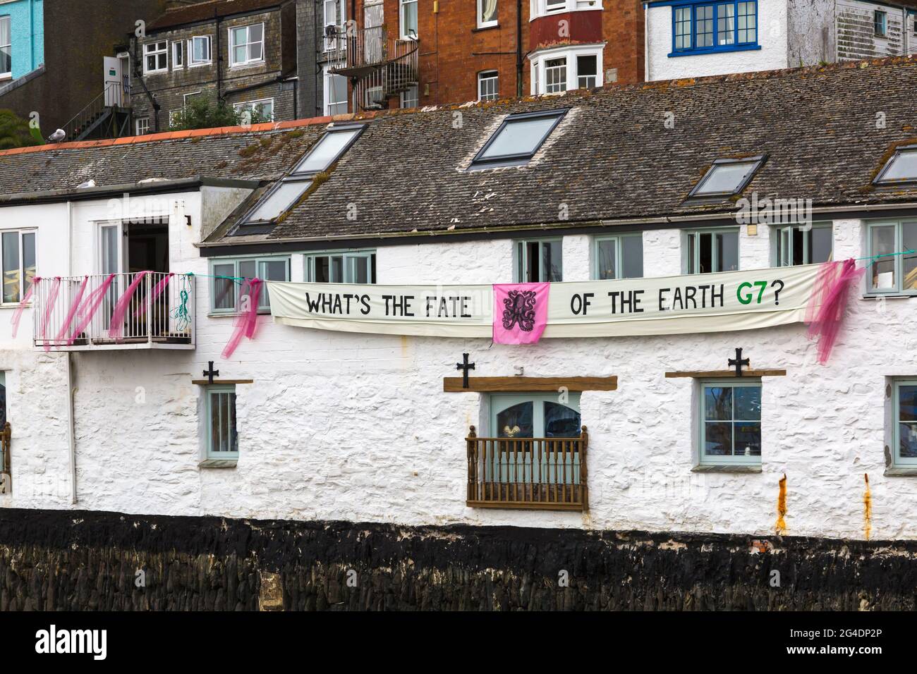 What's the fate of the Earth G7? banner hanging from building at Falmouth, Cornwall UK in June Stock Photo