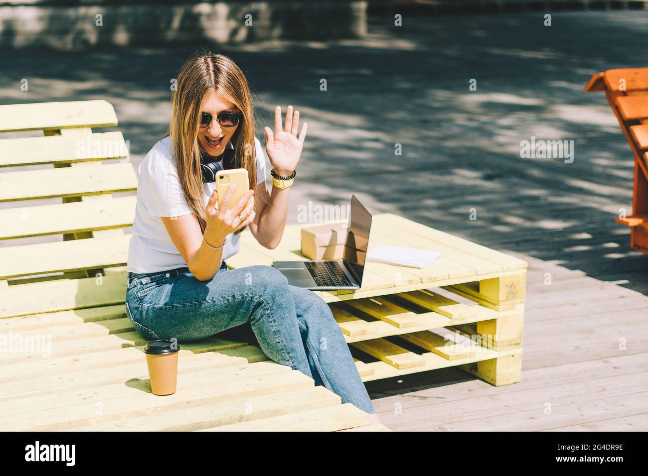 Woman in headphones having a video call Stock Photo - Alamy