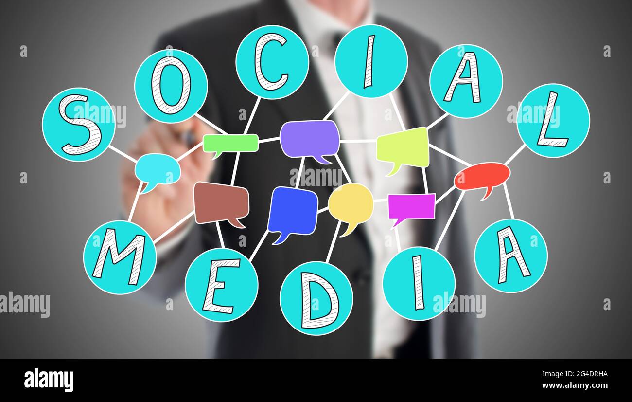 Social media concept drawn by a businessman in background Stock Photo
