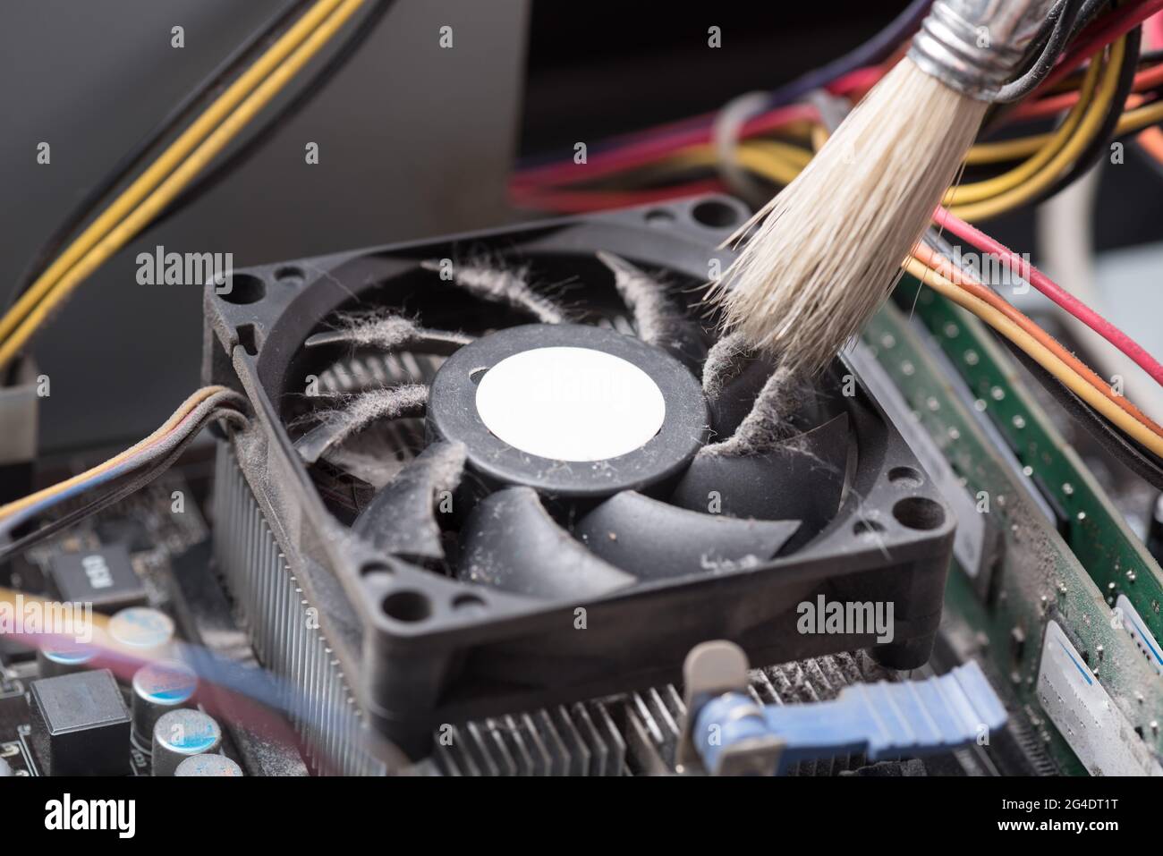 Cleaning a processor fan with a brush Stock Photo - Alamy