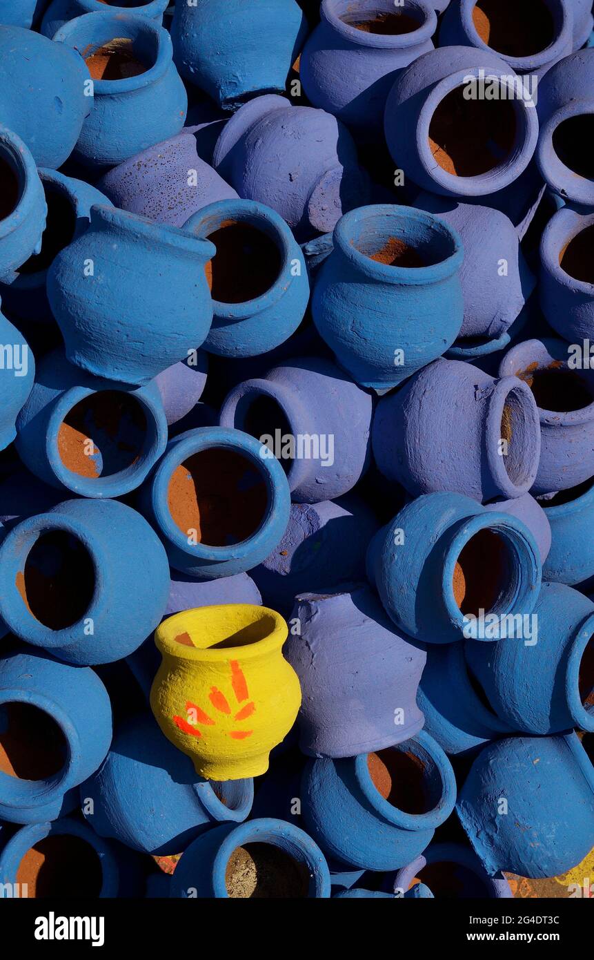 Pune, India - 30 Octo 2018, artist painting colors on terracotta pots, works of handicraft, for sale during Diwali Festival. Stock Photo