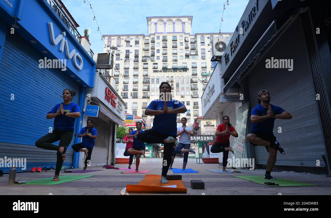 Youth doing yoga on International Yoga Day at galleria Market. Gurugram