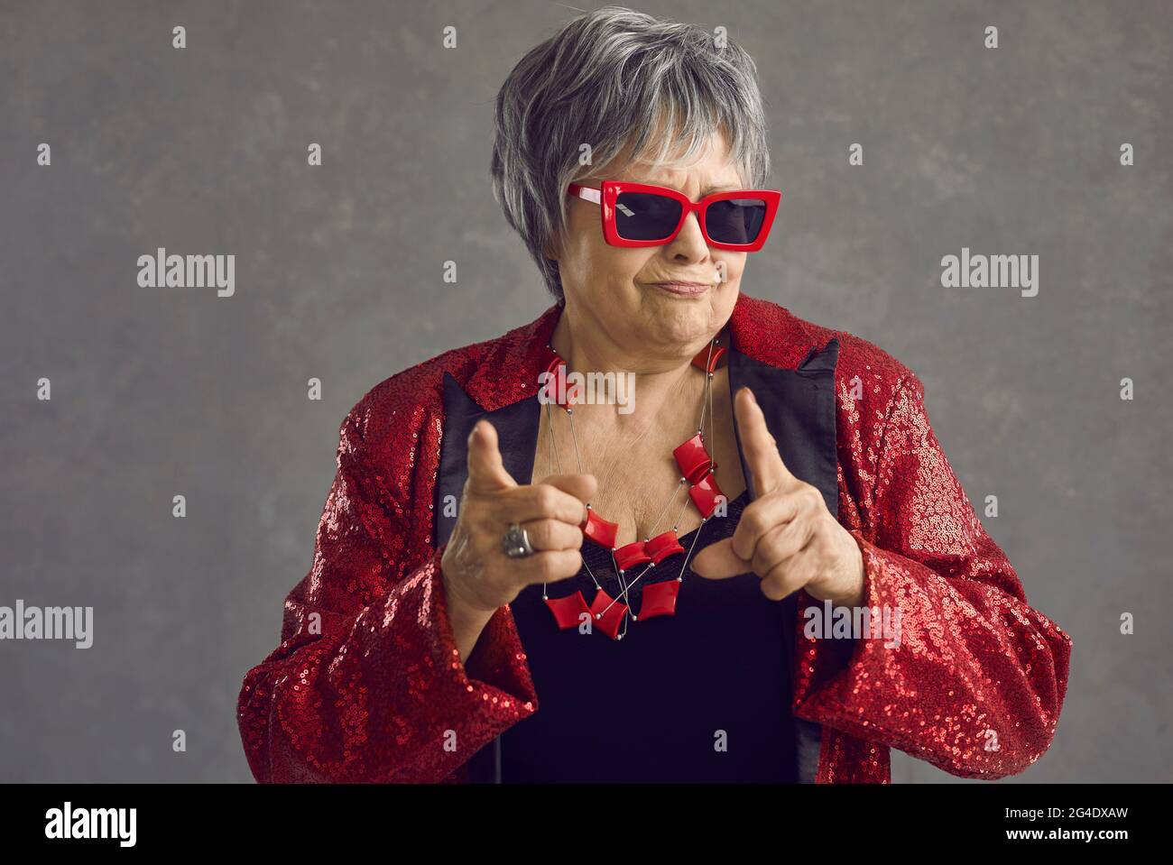 Old funny female crazy confident trendy person studio shot face portrait Stock Photo