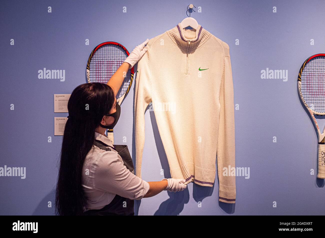 LONDON 21 June 2021. ROGER FEDERER'S CHAMPION CARDIGAN AND RACKET THE  CHAMPIONSHIPS, WIMBLEDON, 2012. Estimate: £40,000-60,000. Christies's  preview of the Roger Federer collection to benefit the Roger Federer  Foundation includes sporting memorabilia