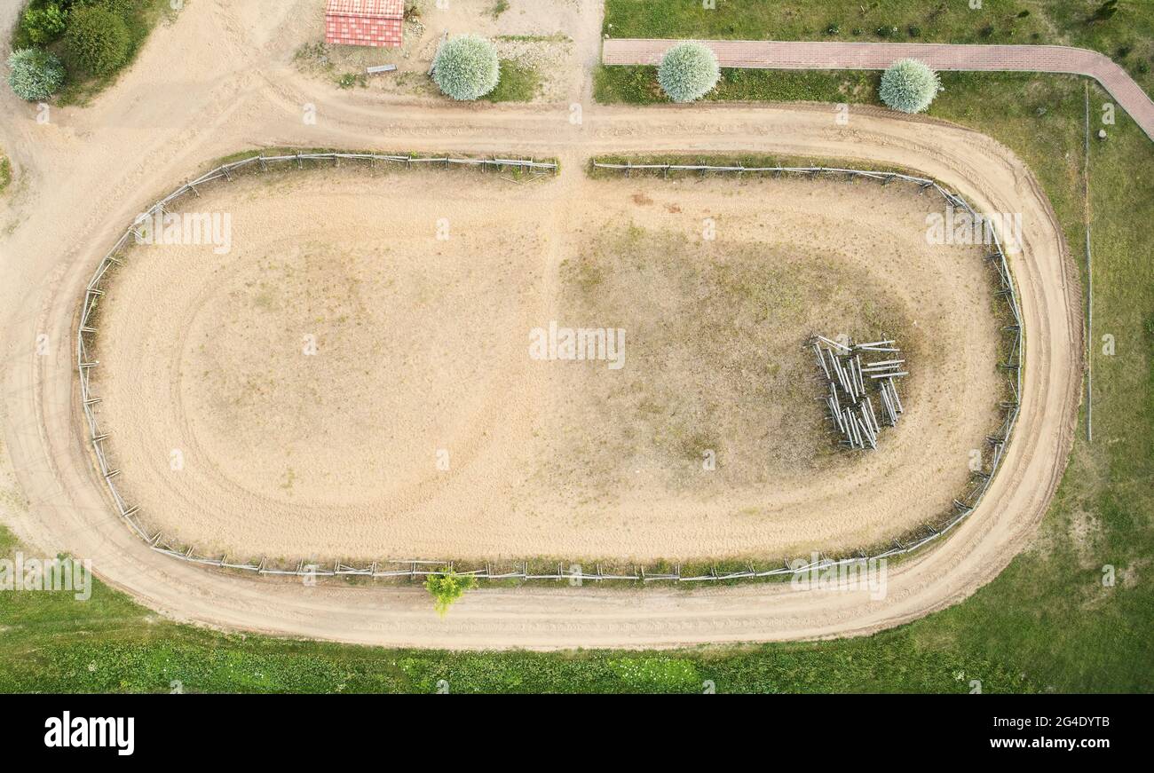Empty sand hippodrome above top drone view in rural area Stock Photo