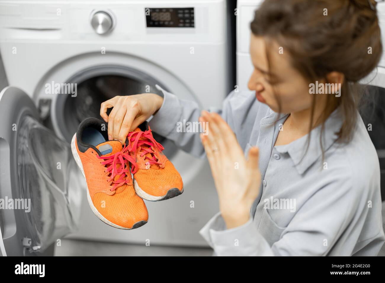Washing dirty shoes in the washing machine Stock Photo Alamy