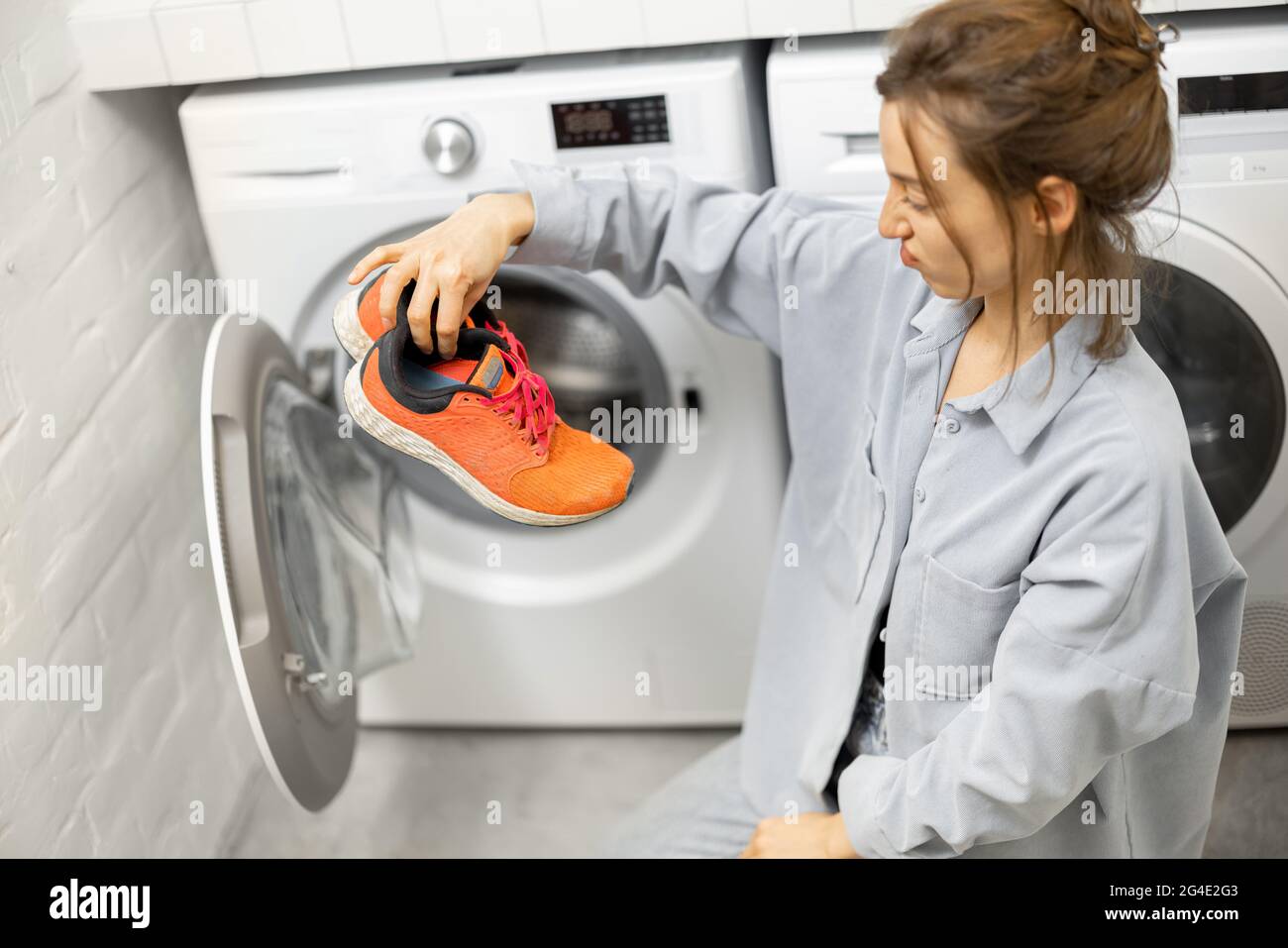 Washing dirty shoes in the washing machine Stock Photo Alamy