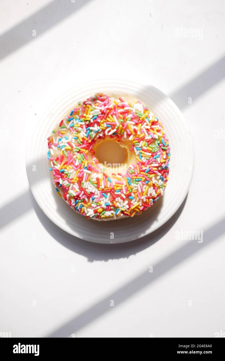 colorful chocolate donuts on plate with copy space Stock Photo - Alamy