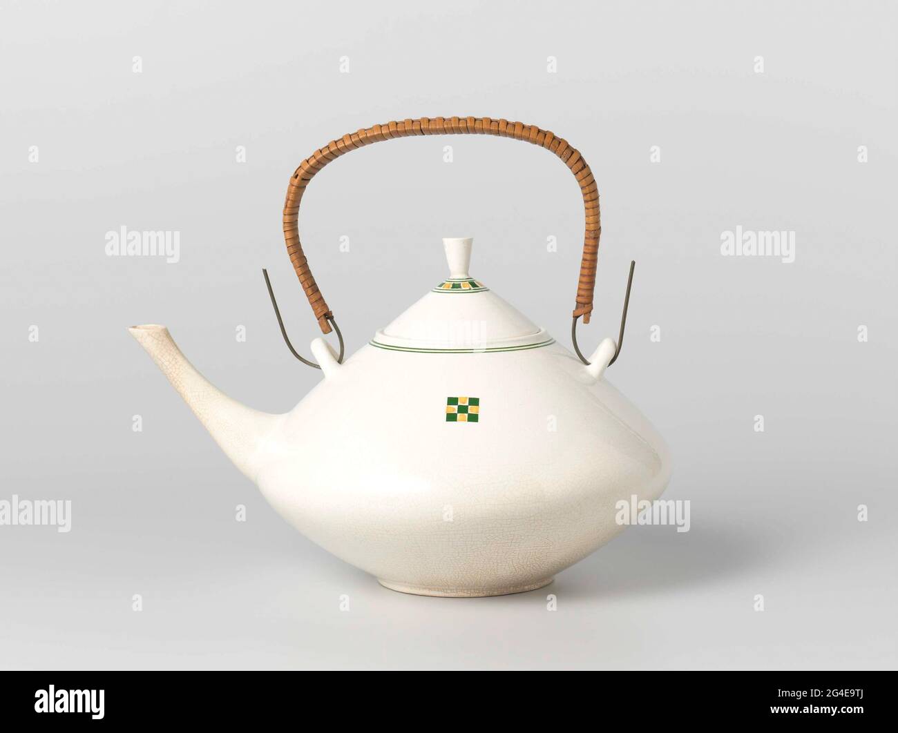 Tea kettle of pottery, decorated with green and yellow squares and a double  green trim along the edges. The boiler has a long spout and a reeds wound  with reeds. Associated