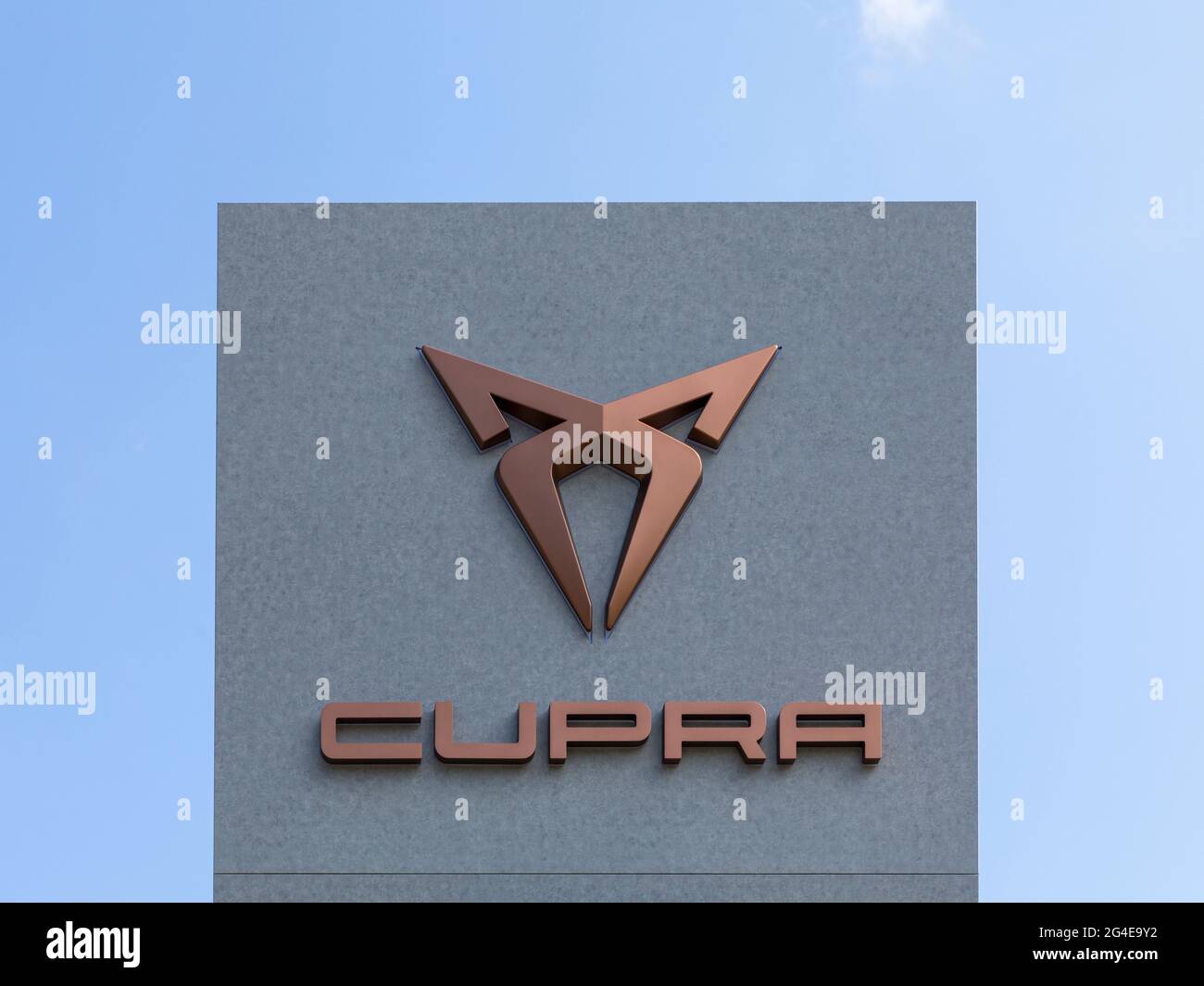 Stade, Germany – June 2, 2021. Copper signage on pole identifying CUPRA car dealership. SEAT Cupra, S.A.U. is the motorsport subsidiary of Spanish aut Stock Photo