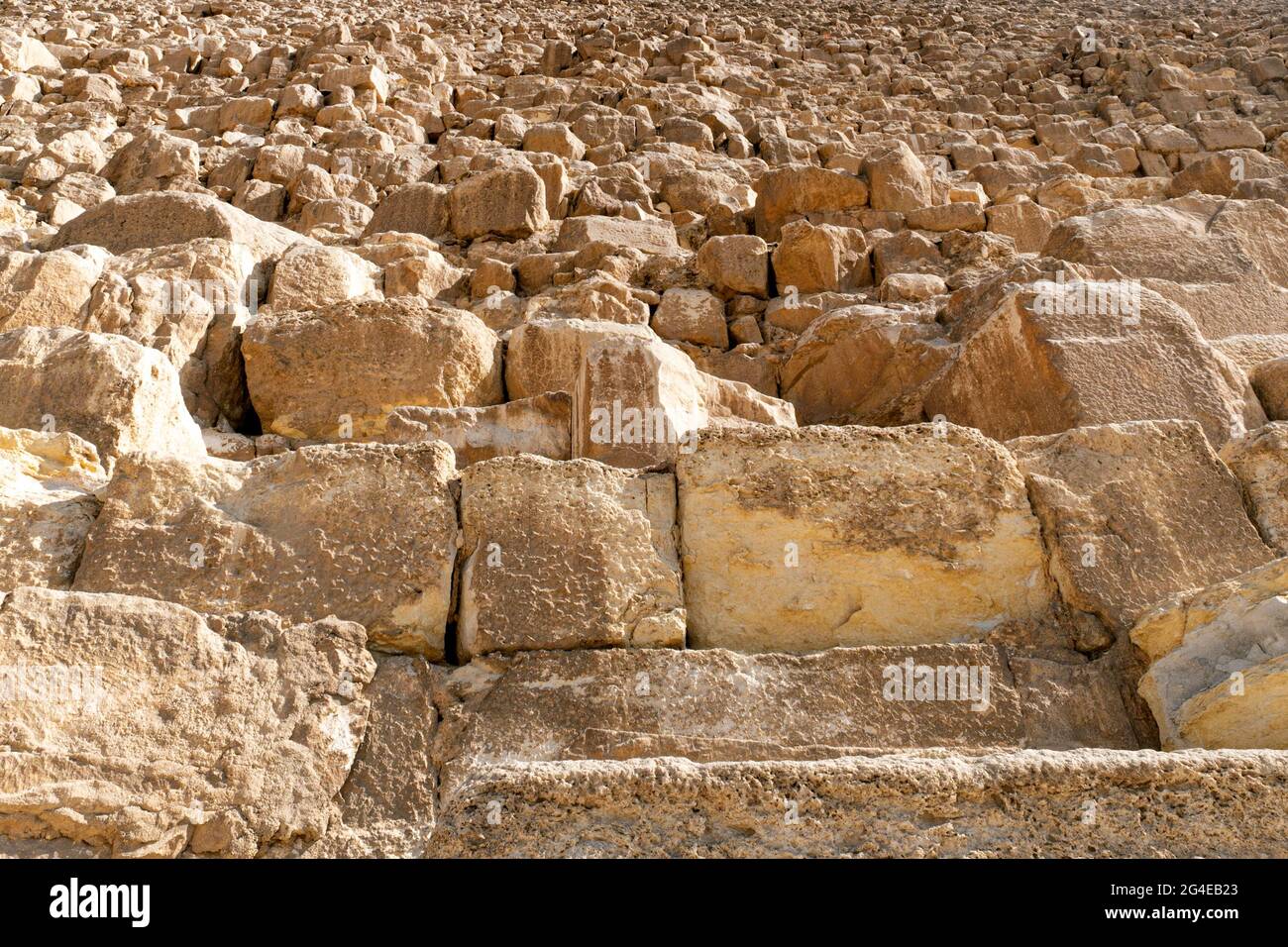 Stone wall of Egyptian pyramids in Giza, close up. Slope of three big