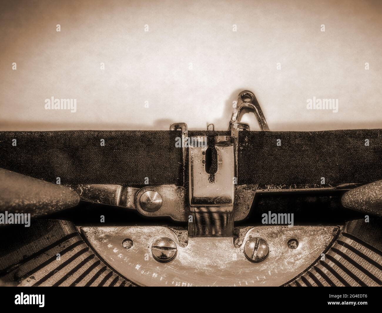 Typewriter Close Up With A Blank Sheet Of Paper Loaded In A Sepia Tone Stock Photo Alamy