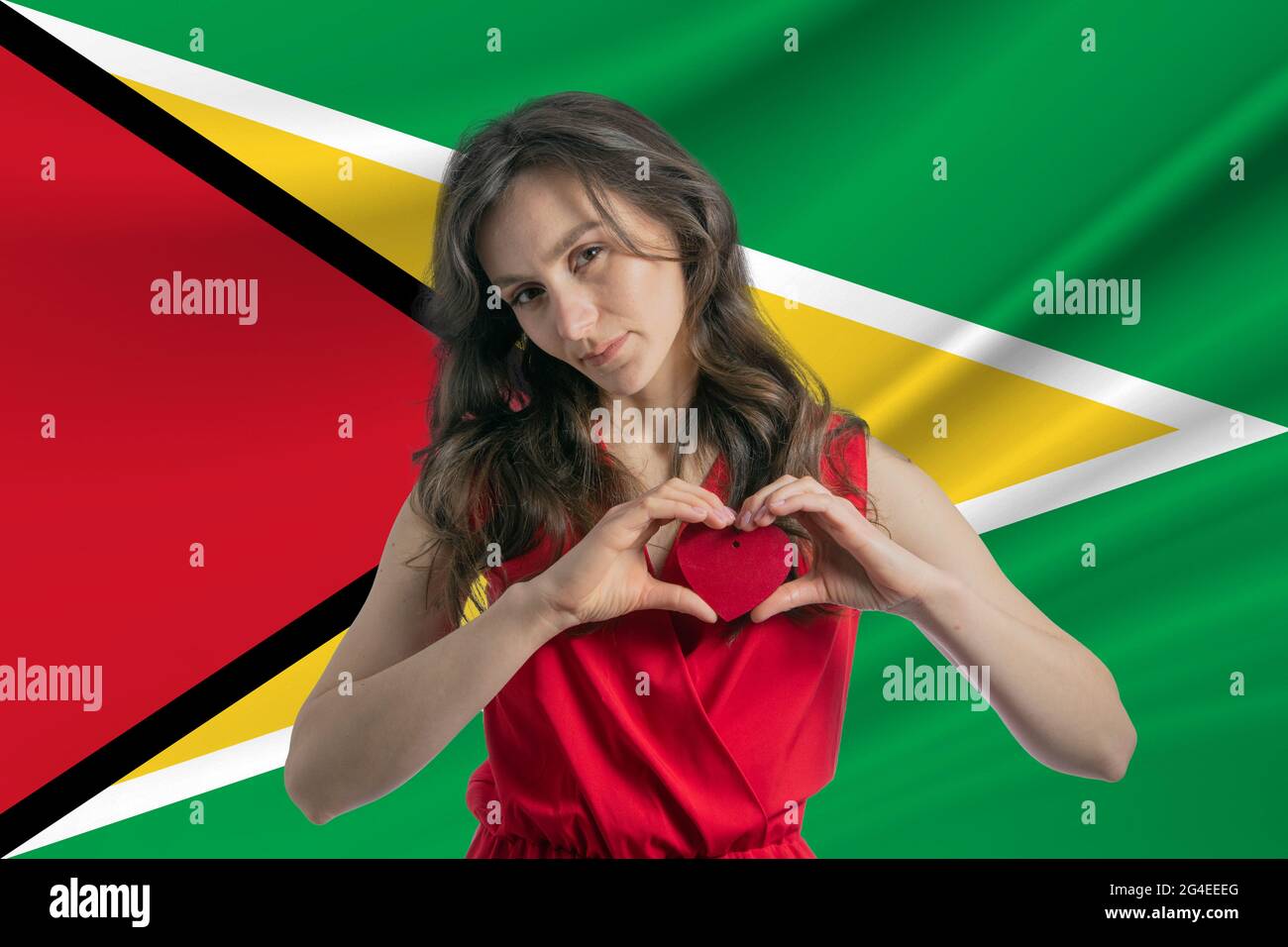 Love Guyana A Girl Holds A Heart On Her Chest In Her Hands Against The