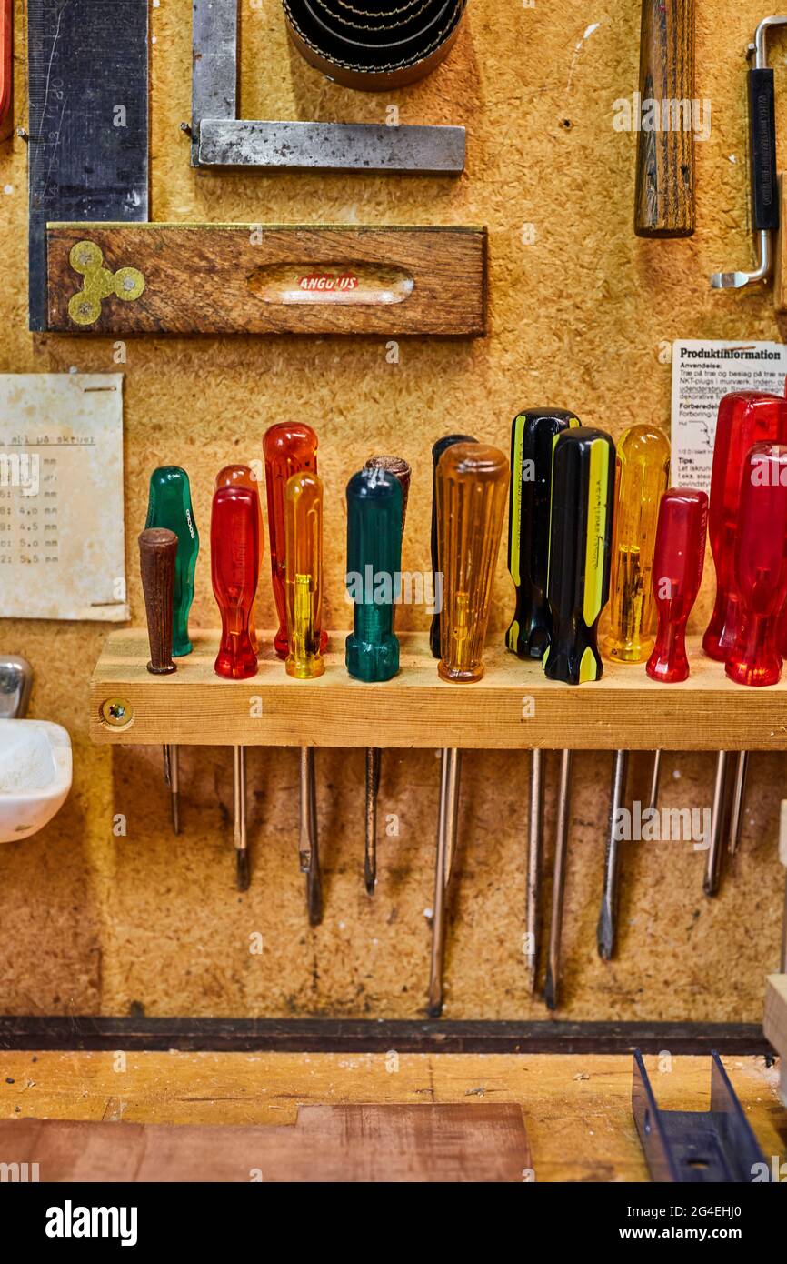 handyman tools hanging in a garden shed Stock Photo