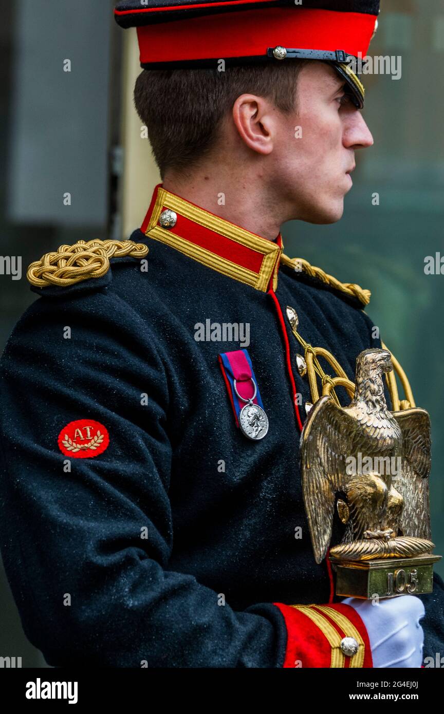 London, UK. 21 Jun 2021. Lance Corporal of Horse Carl Greenhaw,  representing Corporal Styles, the trooper ho captured the Eagle at Waterloo  (who was made a Sergeant as a reward) collects the