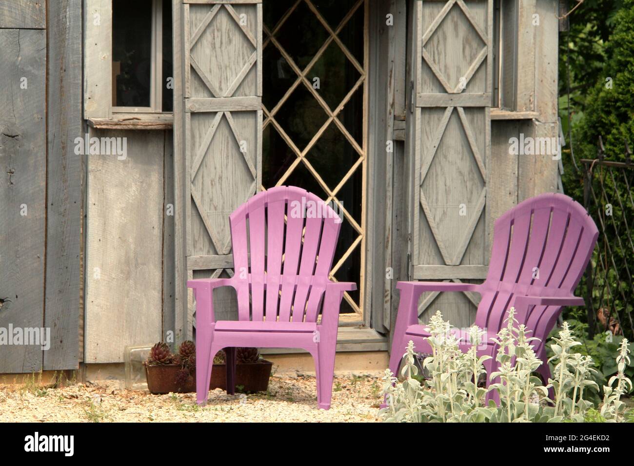 Lawn chairs by a shed in a private property, USA Stock Photo
