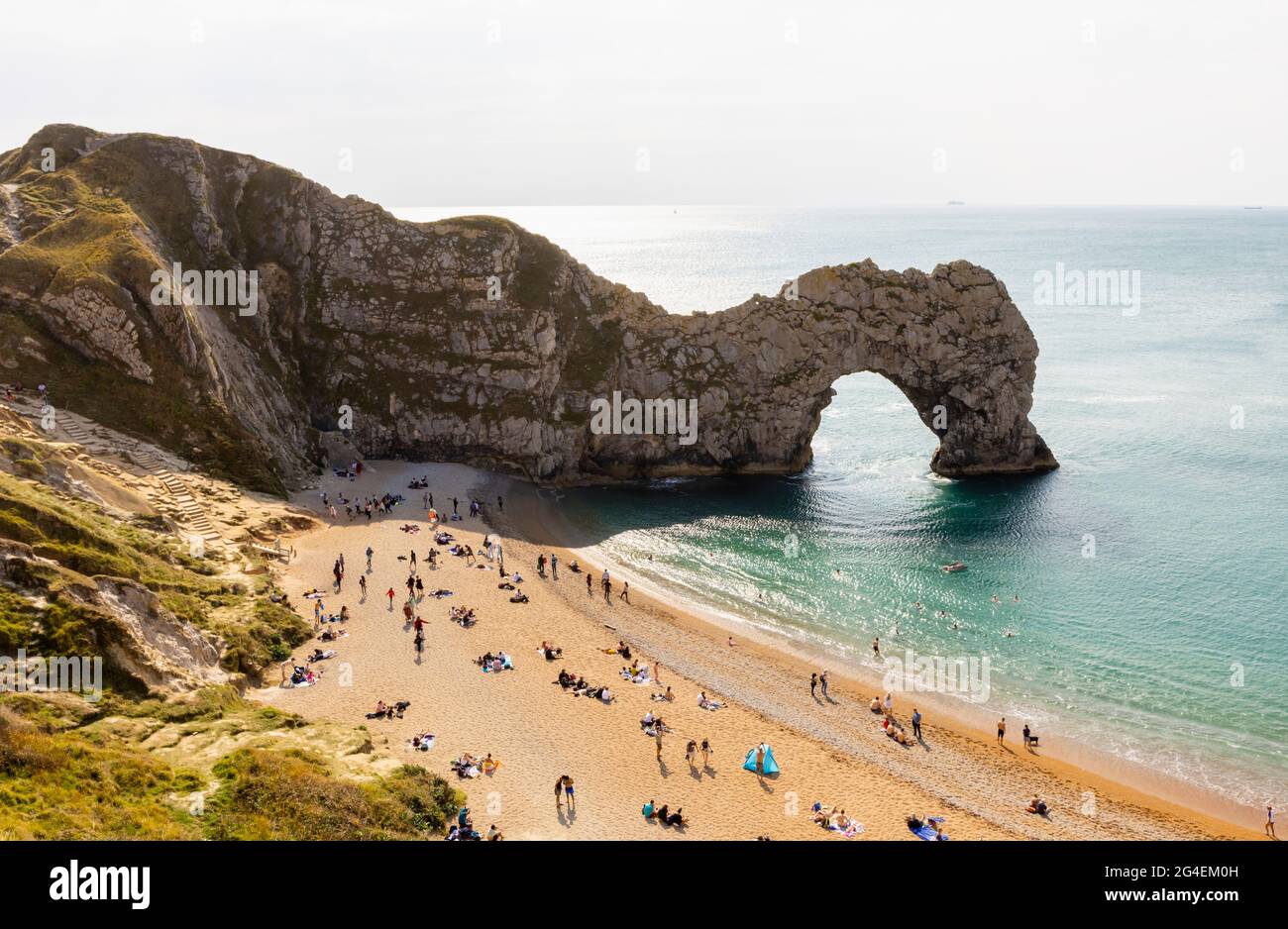 Panoramic coastal clifftop view of picturesque Durdle Door rock formation on the Jurassic Coast World Heritage site in Dorset, south-west England Stock Photo