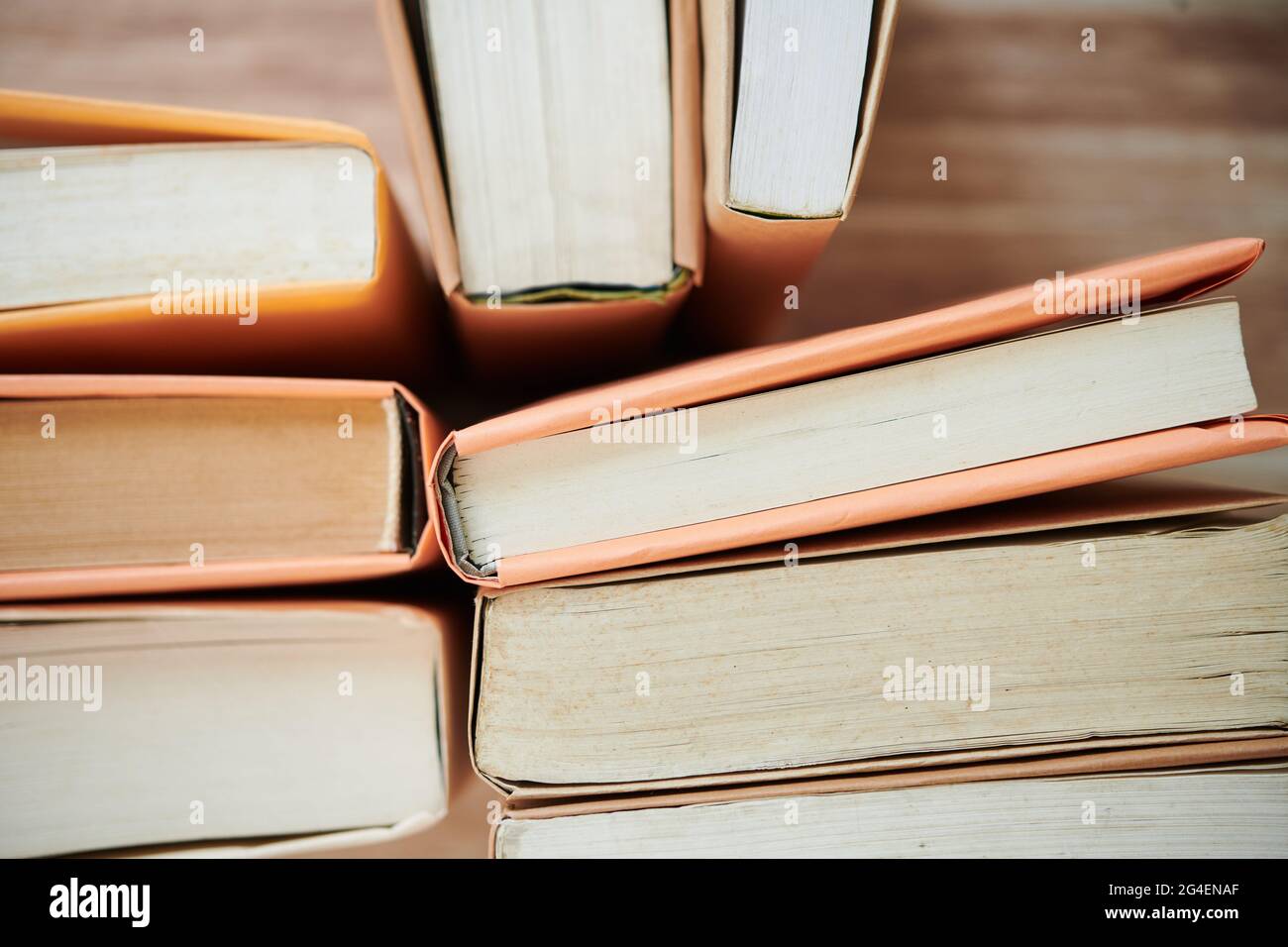 Stack of various books of table in college library, selective focus ...