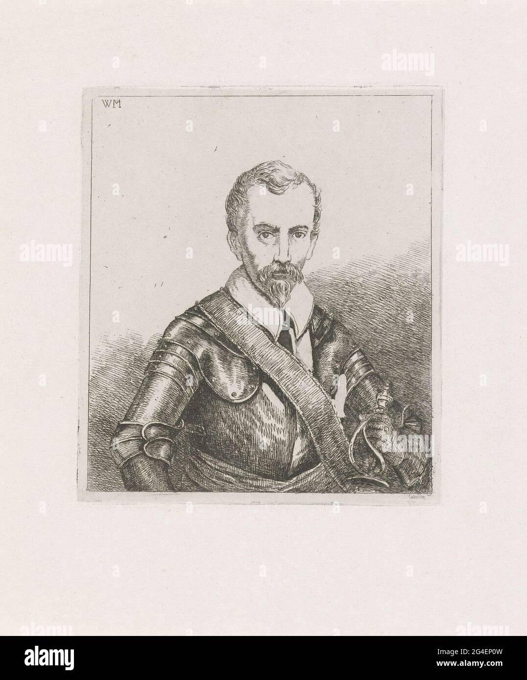 . A man dressed in harness with the hilt of a sword in his hand Stock