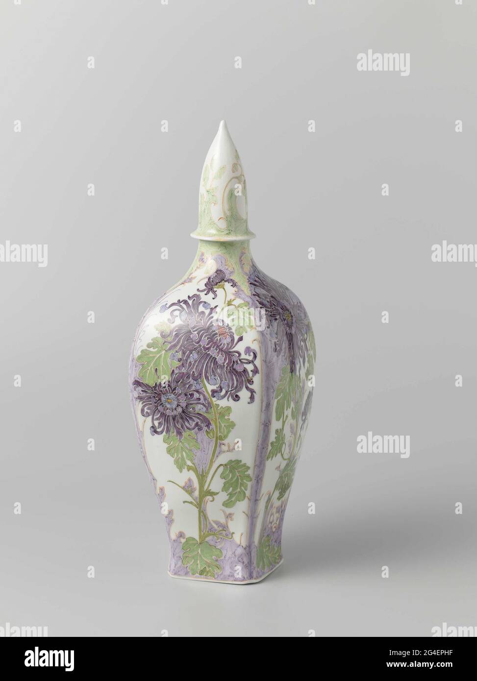 . Porcelain vase, painted with chrysanthemums in green, purple, red and yellow. Rozenburg vase; Painting Amphora. Signature: WG; Amphora / Holland / S / W50 / M121. Stock Photo