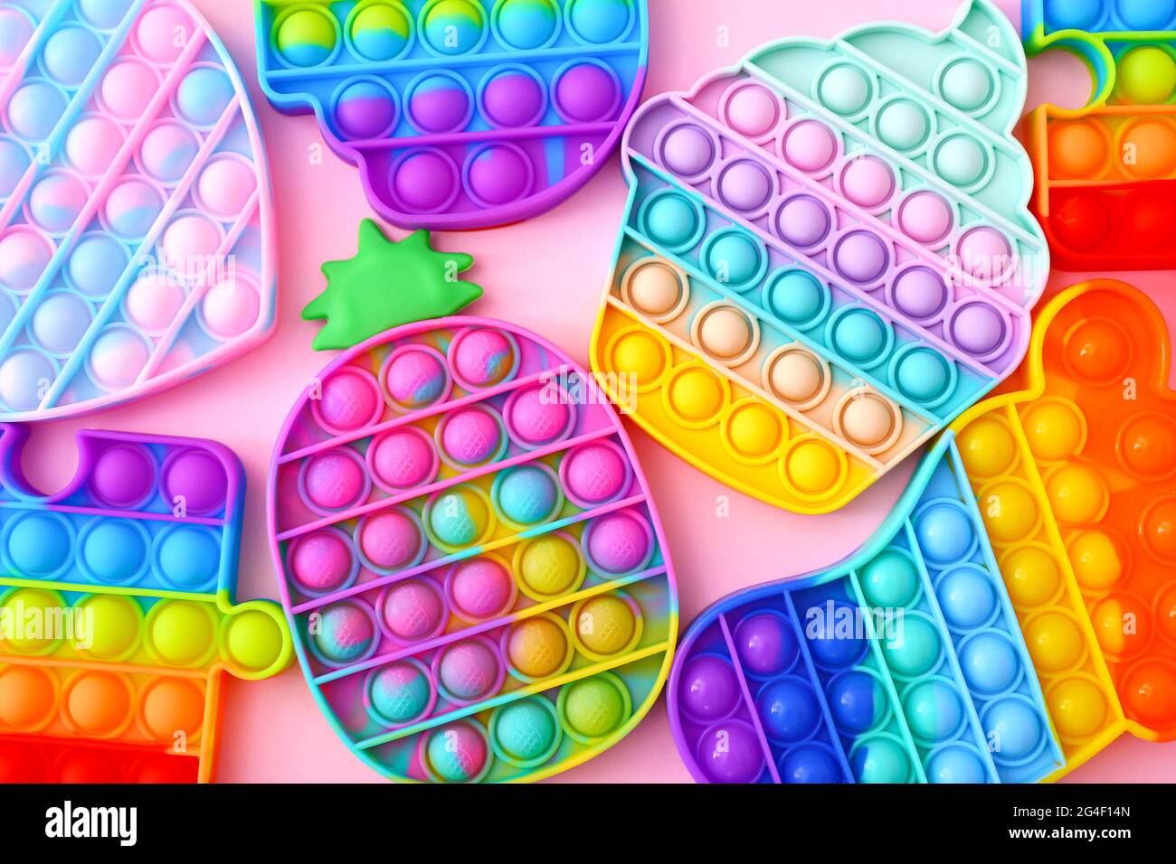 Colorful Push Pop It Bubble Sensory Fidget Toys of different shapes, close up Stock Photo