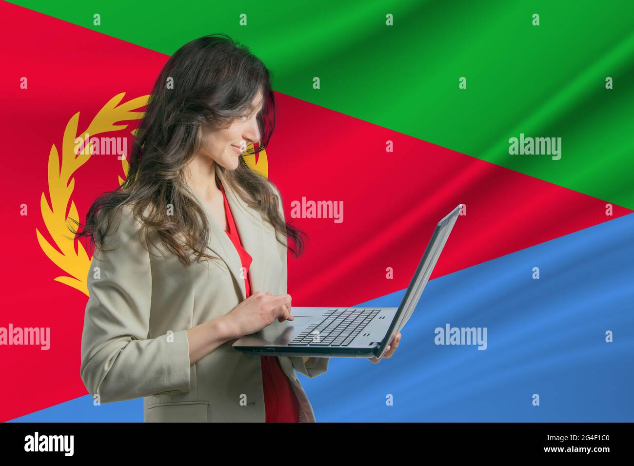 Freelance in Eritrea Beautiful young woman freelancer uses laptop ...