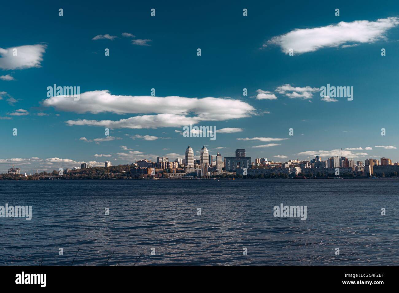 A large body of water with a city in the background Stock Photo - Alamy