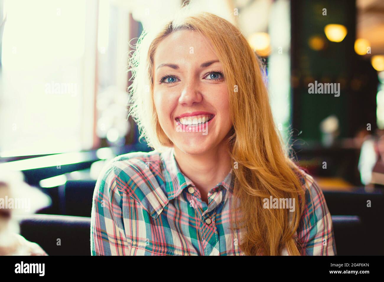 Positive blonde girl smiling hi-res stock photography and images - Alamy