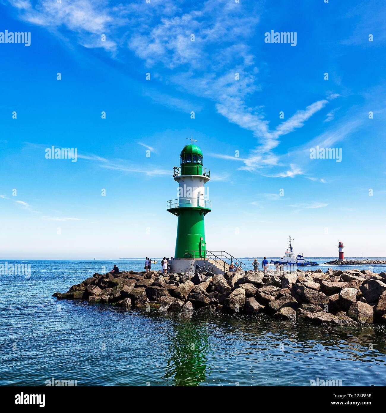 Pier light West, green-white lighthouse in the harbour entrance Warnemuende, Hanseatic city Rostock, Mecklenburg-Western Pomerania, Germany Stock Photo
