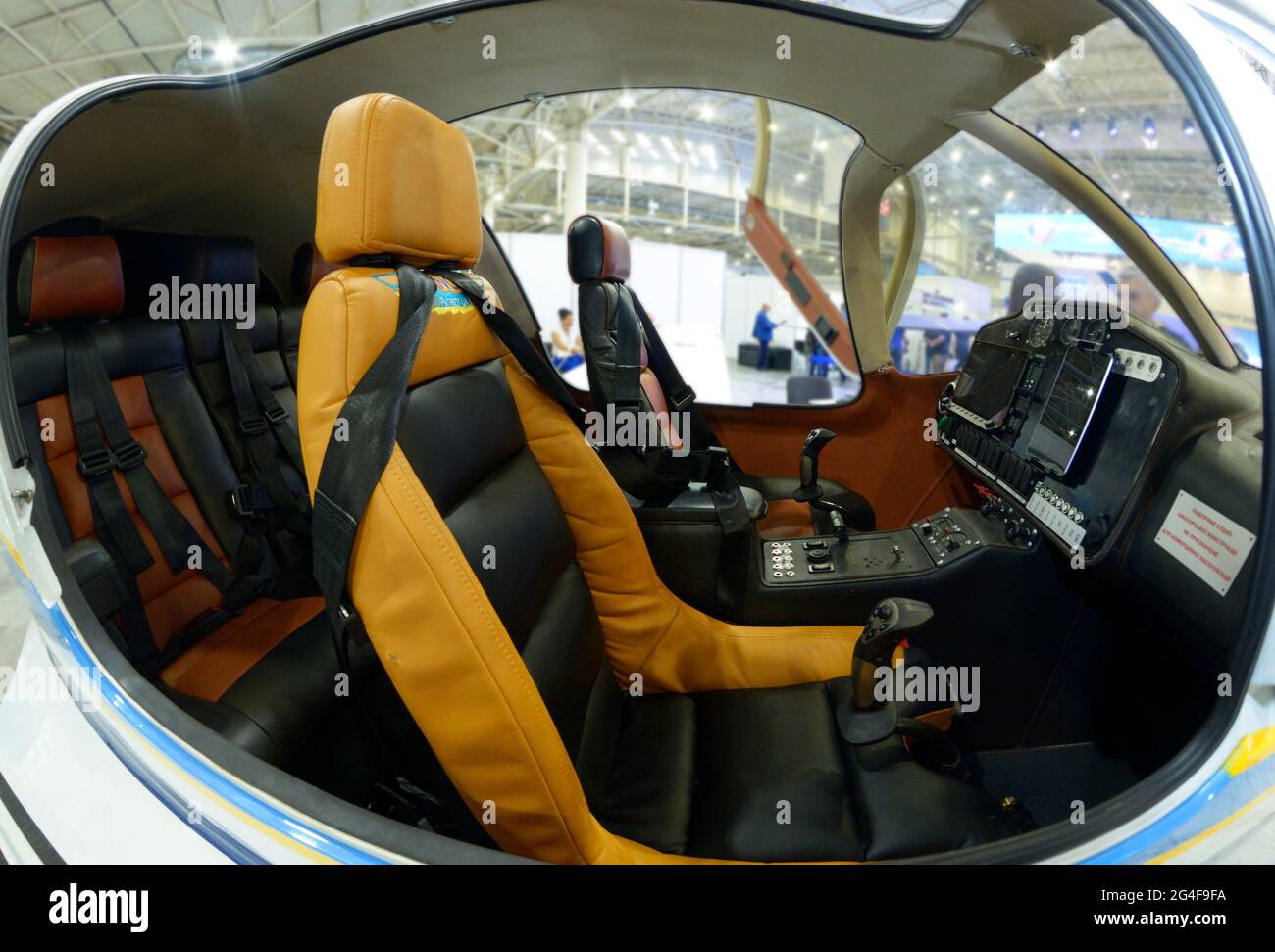 Cockpit of a light passenger plane dashboard, steering wheel, pilot and