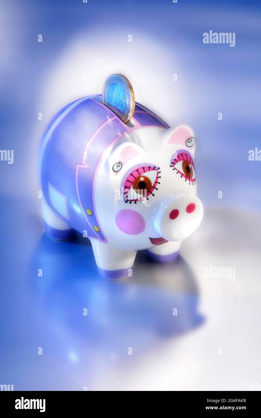 Piggy bank with one euro coin Stock Photo