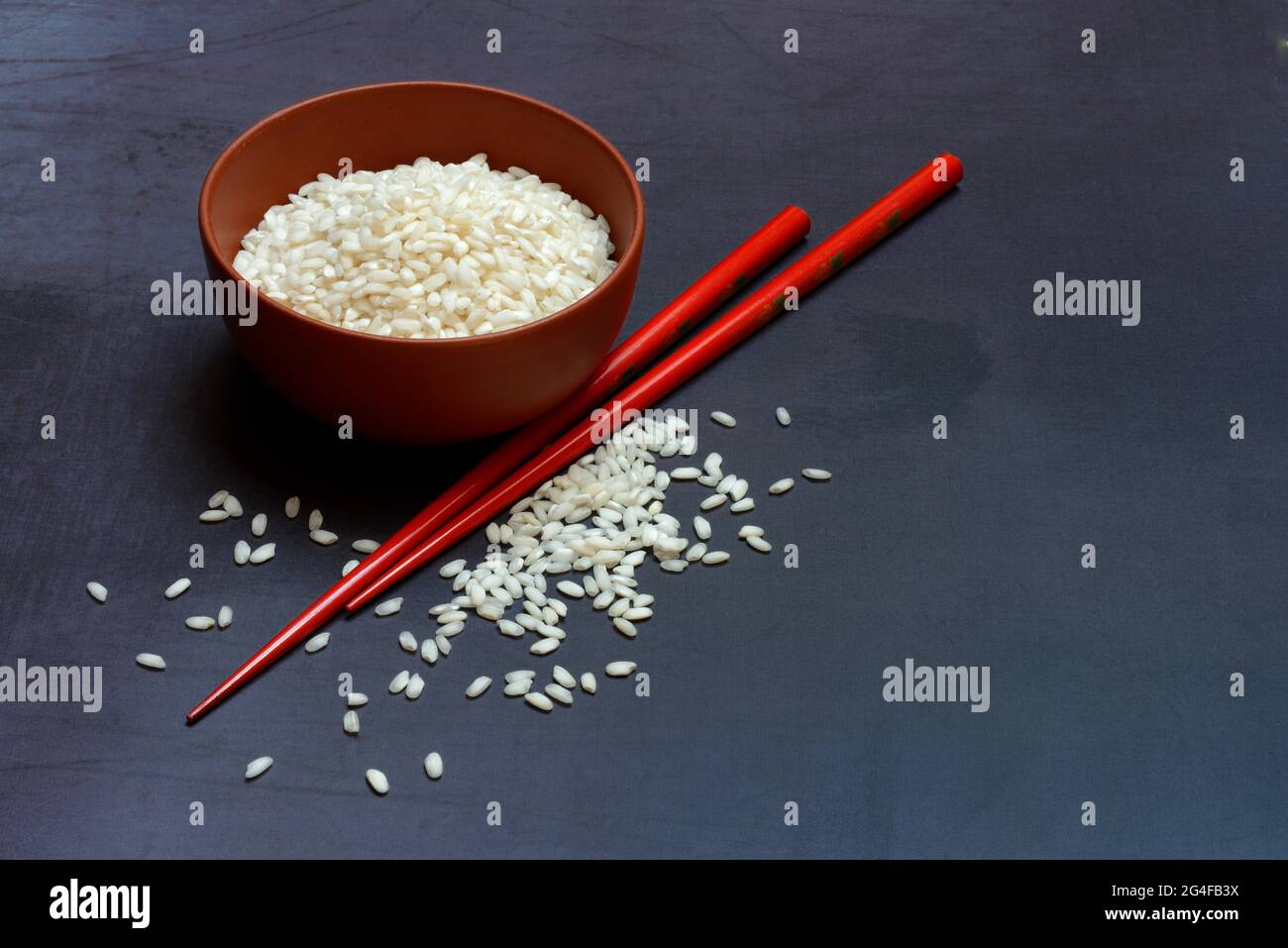 Rice, rice grains in bowl with chopsticks, Germany Stock Photo - Alamy