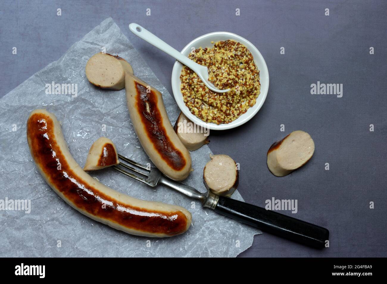 Sliced bratwurst and skin with Dijon mustard, Germany Stock Photo Alamy