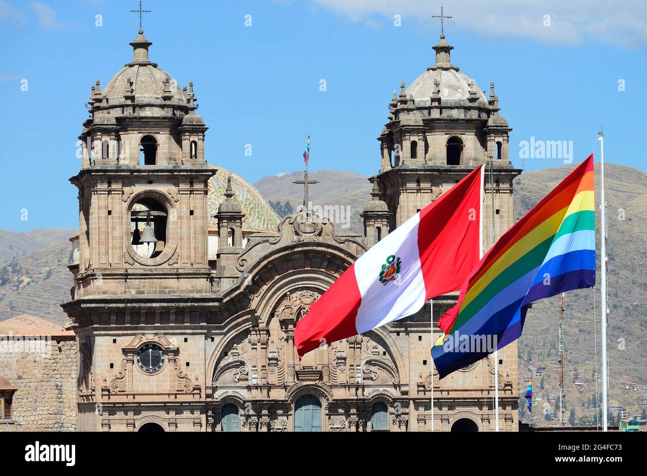 Cathedral Catedral Basilica de la Virgen de la Asuncion with flags of the city and Peru, Cusco, Peru Stock Photo
