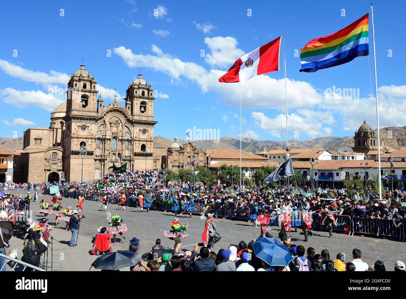 Cathedral Catedral Basilica de la Virgen de la Asuncion with flags of the city and Peru at the Plaza de Armas, Cusco, Peru Stock Photo