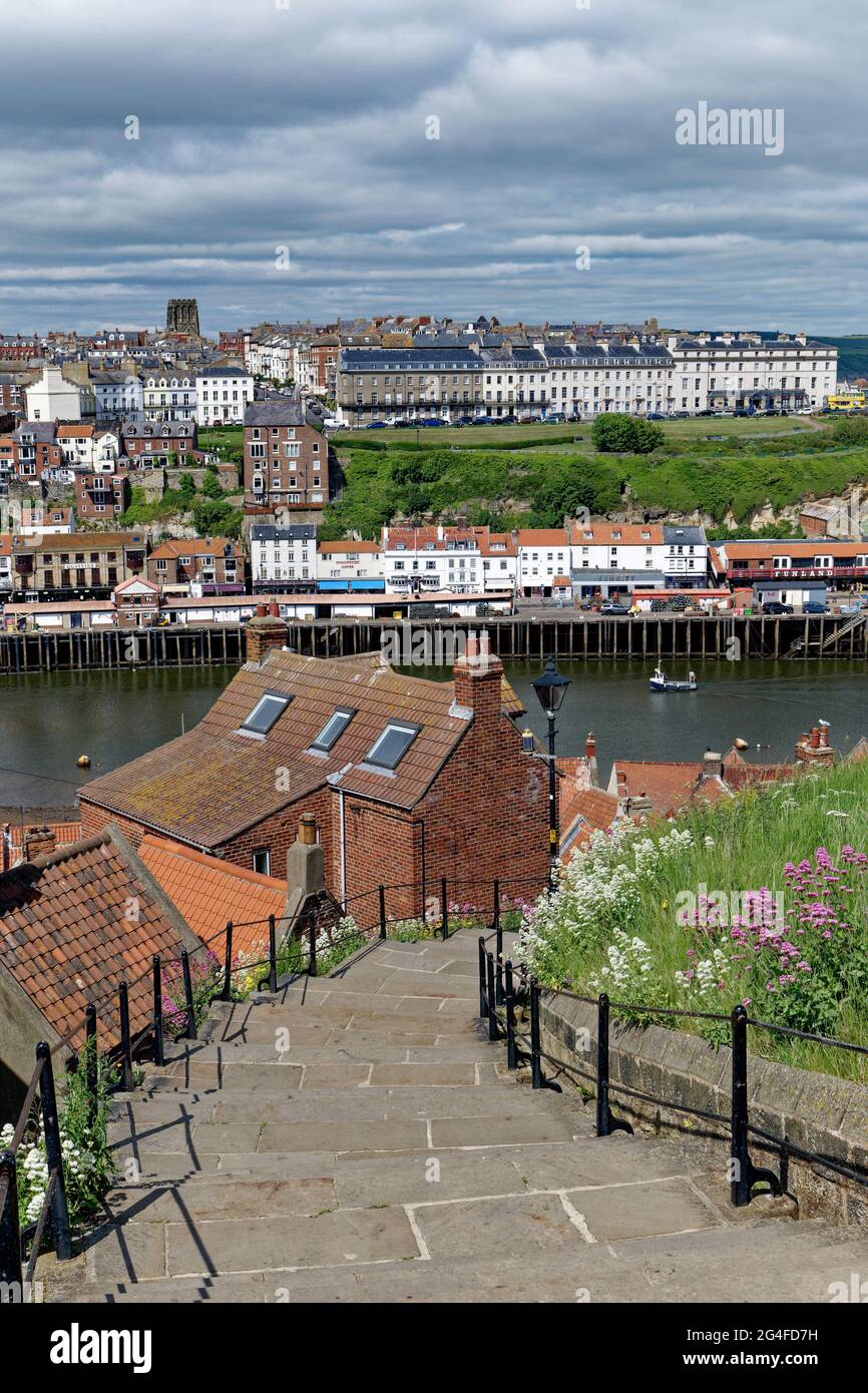 199 stone steps lead up from the harbour to Whitby Abbey and allow a superb view over this pretty fishing port in Yorkshire Stock Photo