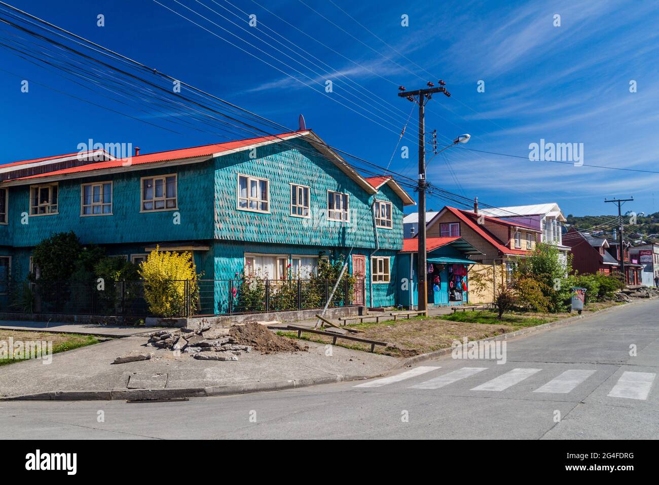 ACHAO, CHILE - MARCH 21, 2015: View of houses lining streets of Achao village, Quinchao island, Chile Stock Photo