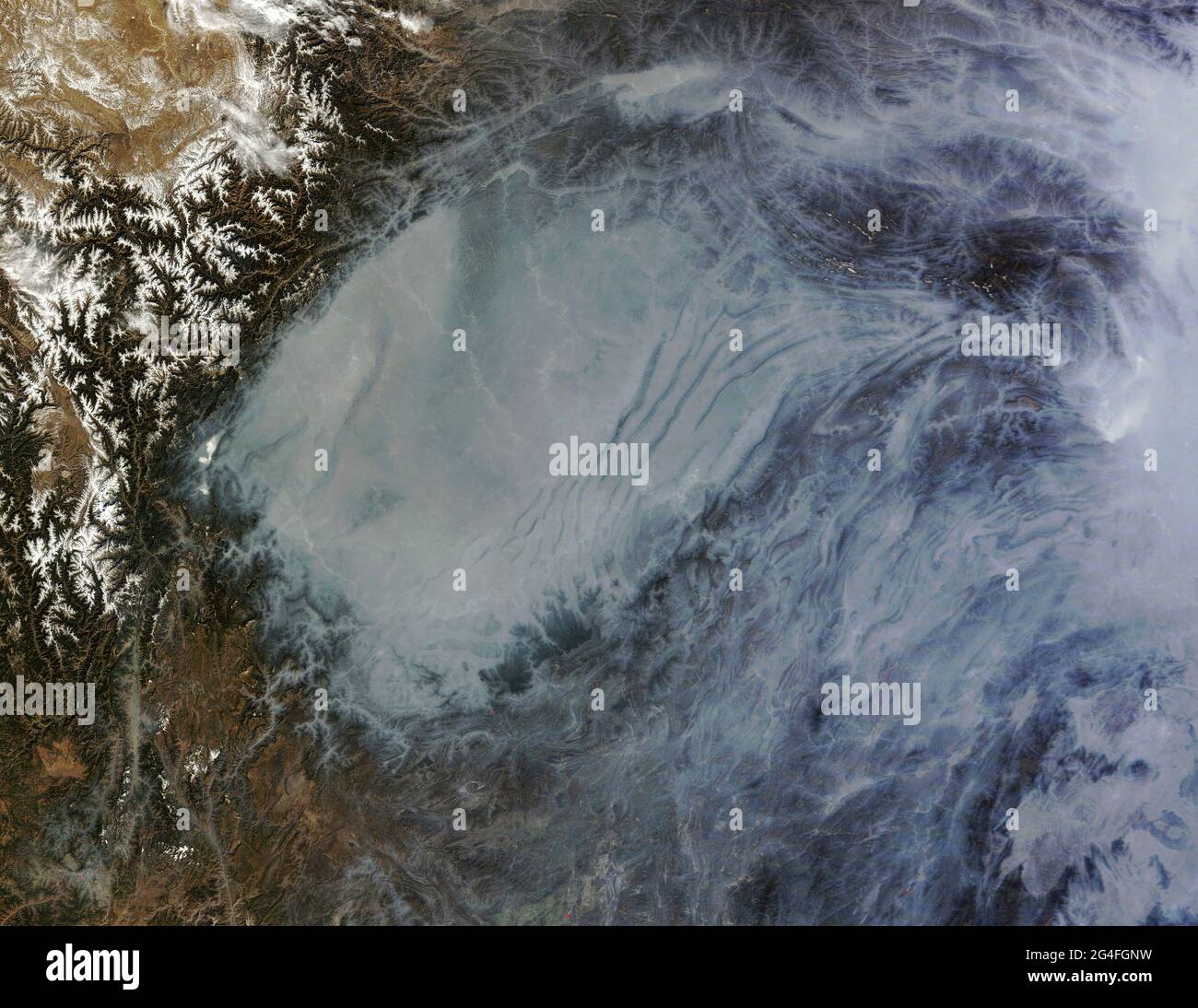 CHINA - 29 January 2014 - This NASA MODIS Terra true-colour satellite image released today (29/01/2014) of a layer of heavy haze that filled China’s S Stock Photo
