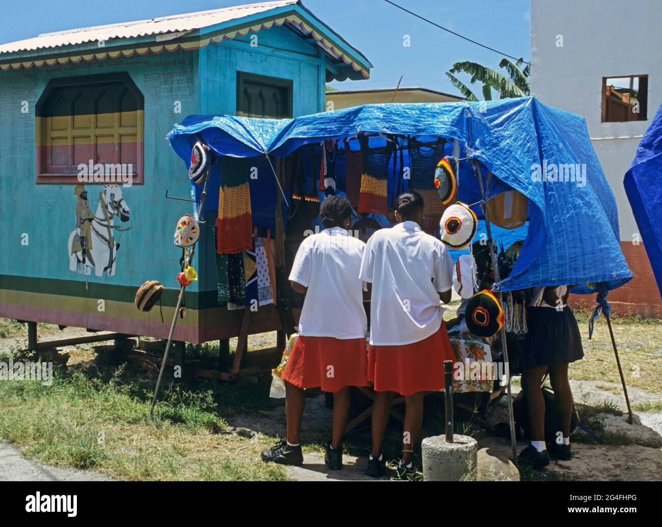 local girls at clothes stall in Castries - St Lucia Island - Caribbean Stock Photo